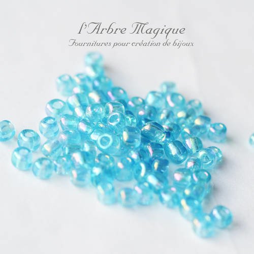 10g rocaille bleu ab transparente plus ou moins 100 perles