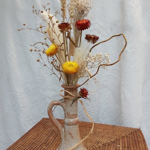 Bouquet de fleurs séchées avec son vase