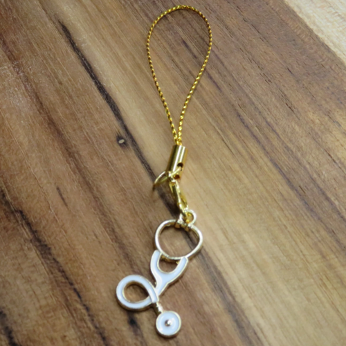 Bijou de téléphone doré stéthoscope émaillé kawaii