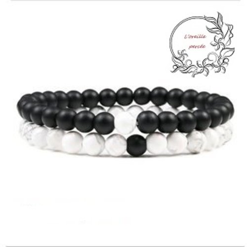 2 bracelets élastiques pierre naturelle noire/blanche