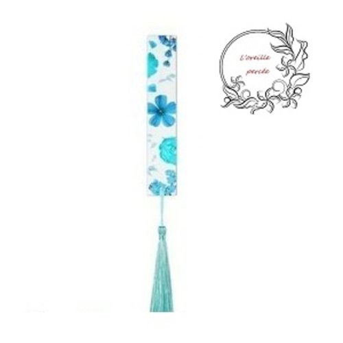 Marque page transparent fleurs ton bleues et son pompon bleu clair