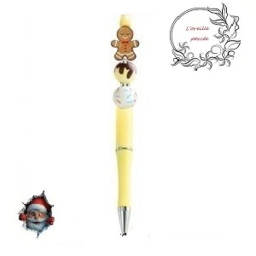 Stylo à bille jaune et son bonhomme pain d'épice