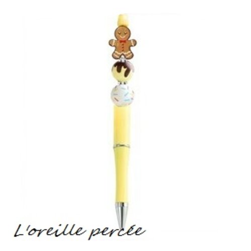 Stylo à bille jaune et son bonhomme pain d'épice