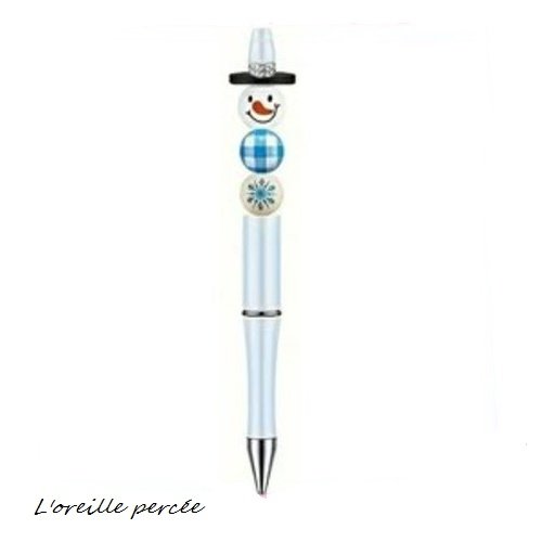 Stylo à bille blanc et son bonhomme de neige