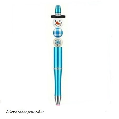 Stylo à bille bleu et son bonhomme de neige