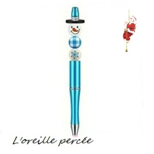 Stylo à bille bleu et son bonhomme de neige