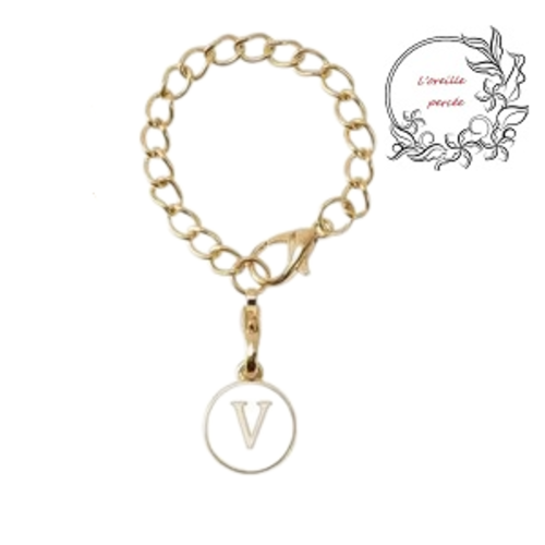 Bijou de sac chaîne dorée et son médaillon blanc lettre v
