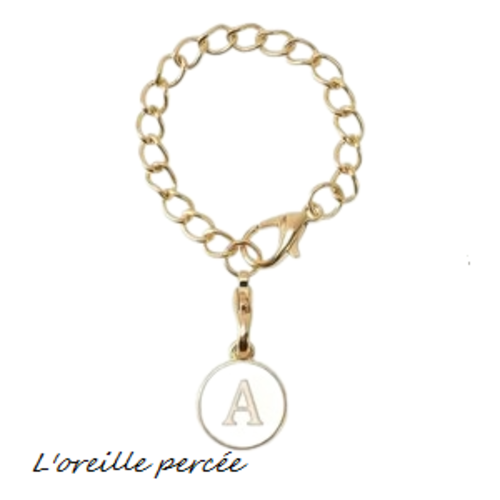 Bijou de sac chaîne dorée et son médaillon blanc lettre a
