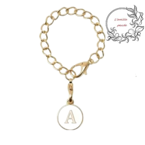 Bijou de sac chaîne dorée et son médaillon blanc lettre a
