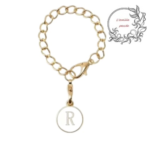 Bijou de sac chaîne dorée et son médaillon blanc lettre r