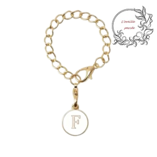 Bijou de sac chaîne dorée et son médaillon blanc lettre f