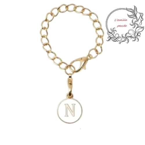 Bijou de sac chaîne dorée et son médaillon blanc lettre n
