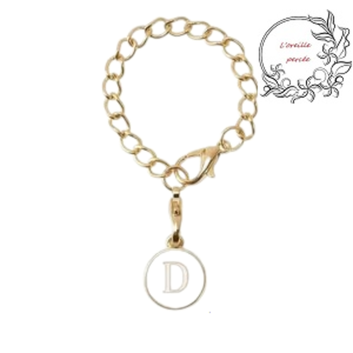Bijou de sac chaîne dorée et son médaillon blanc lettre d