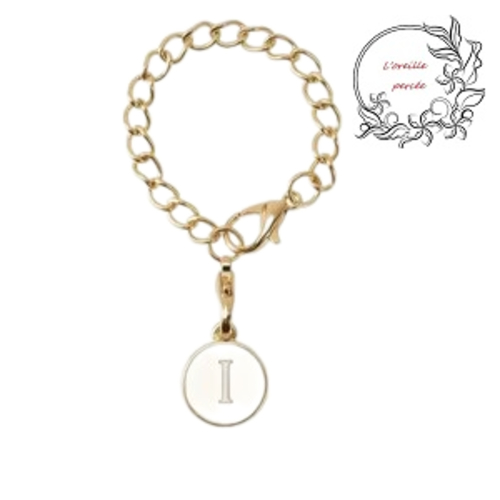 Bijou de sac chaîne dorée et son médaillon blanc lettre i