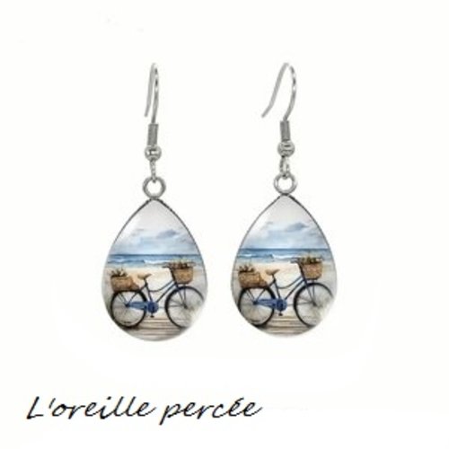 Boucle d'oreille goutte vélo à la plage