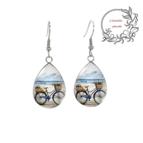 Boucle d'oreille goutte vélo à la plage
