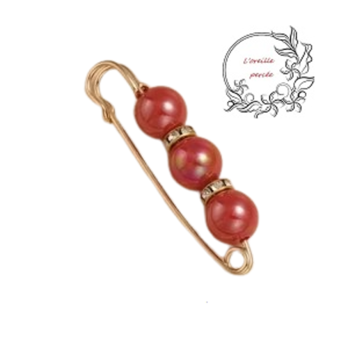 Broche épingle et ses perles rondes rouges à reflet et ses rondelles strass