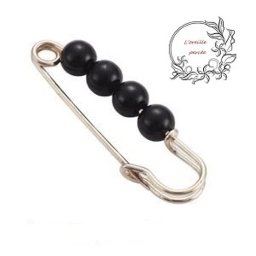 Petite broche épingle dorée et ses perles noires