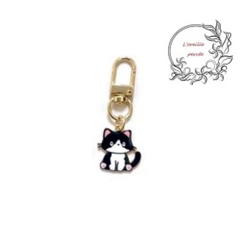 Porte clé chat noir et blanc émail