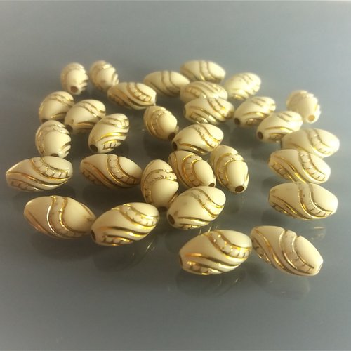 30 perles ovales beiges en acrylique motif doré