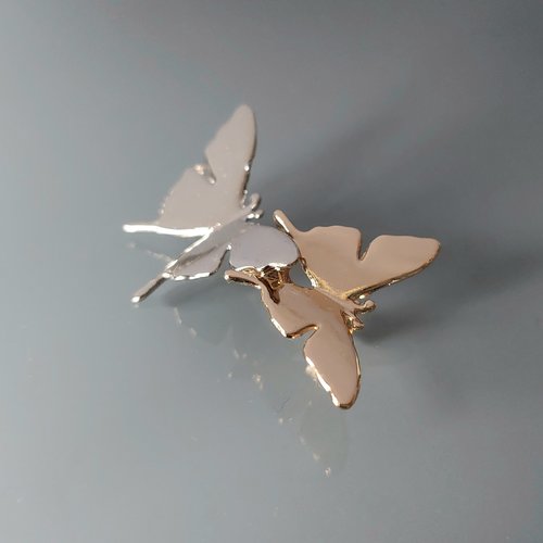 Broche papillon métal coloris argent et doré