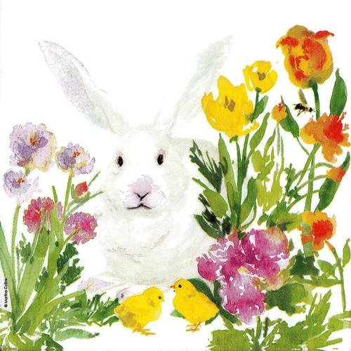Serviette lapin blanc caché dans les fleurs et les tulipes 