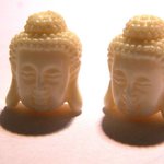 Lot de 10 perles tête de Bouddha en corail de synthese 15x10 mm 