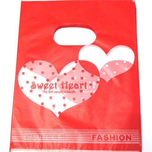 10 sachets plastique à anse 20x15cm rouge motif coeur 