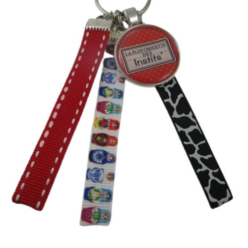 Porte clés rouge et multicolore "la plus chouette des instits"