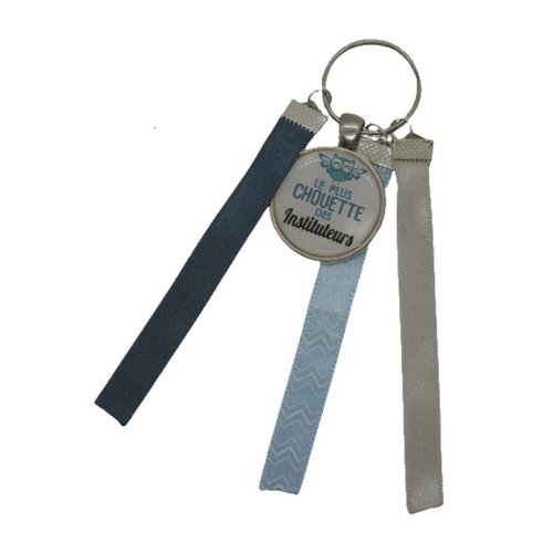 Porte clés bleu, gris et beige "le plus chouette des instituteurs'"