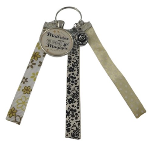 Porte clés beige et noir "maîtresse avec un sourire magique"