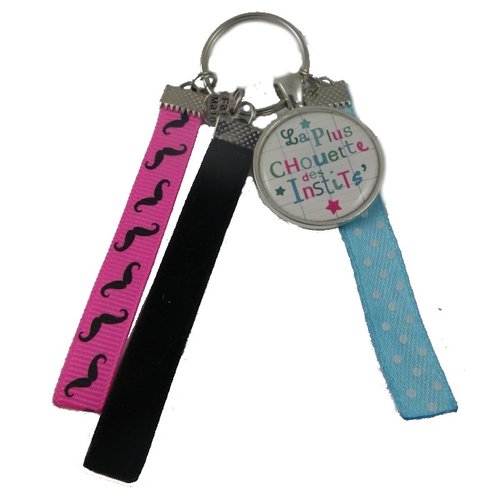 Porte clés bleu, rose et noir "la plus chouette des instits"