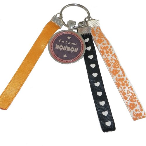 Porte clés orange et noir "on t'aime nounou"