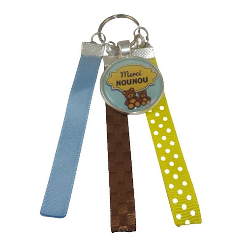 Porte clés bleu, jaune et marron "merci nounou"