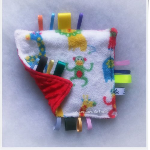 Doudou plat aux étiquettes jungle blanc/rouge