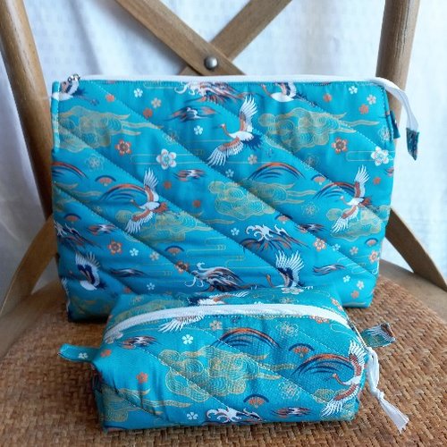 Duo de trousse a tout: les cigognes