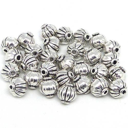 10 perles toupie 7mm en métal argenté strié