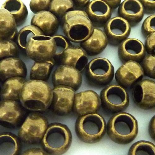 Lot de 25 perles ronde lisse 6,5mm gros trou 3,8mm en métal bronze