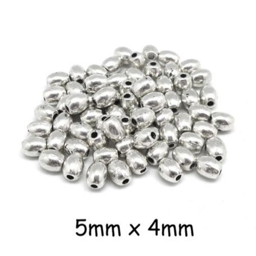 50 petites perles olive en métal argenté lisse pour cordon 1mm