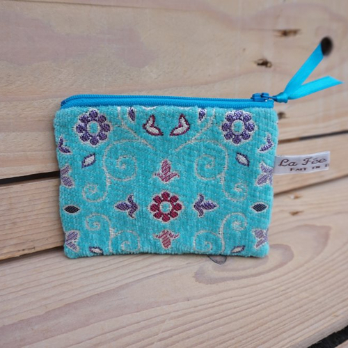Pochette zip 12cm textile turquoise motifs fleurs graphiques coloris rose et violet