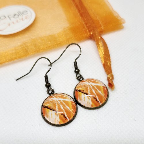 Boucles d'oreilles bronze pendantes cabochon verre motif abstrait orangé