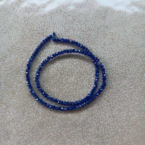 Fil de perles rondelles à facettes bleues en verre 3x2mm x130perles vpble9-15