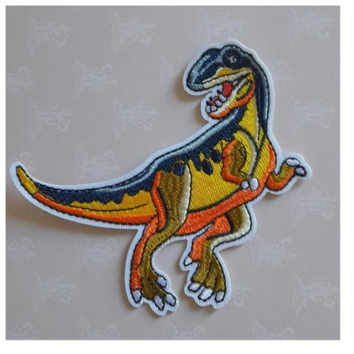 Dinosaure thermocollant orange, bleu et jaune en polyester pour customiser des vêtements d'enfants, couettes, sac, de 8,50 cm de hauteur.