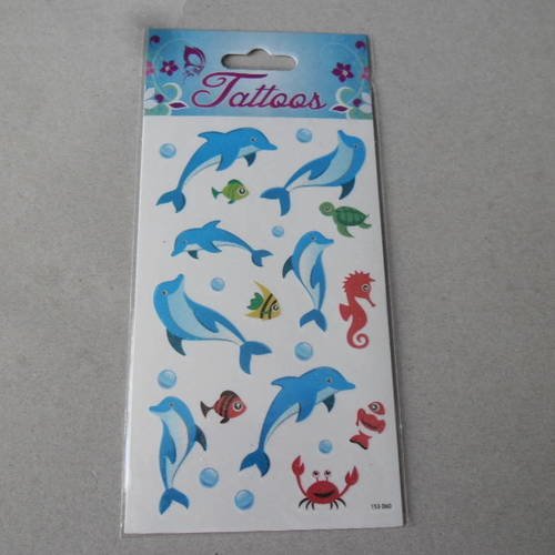 X 1 plaque de tatouages représentant des dauphins et autre poissons multicolore pailleté 