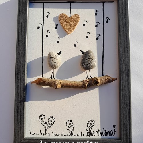 Cadre couple d'oiseaux sur une branche de bois/galet/pierre/ecorce