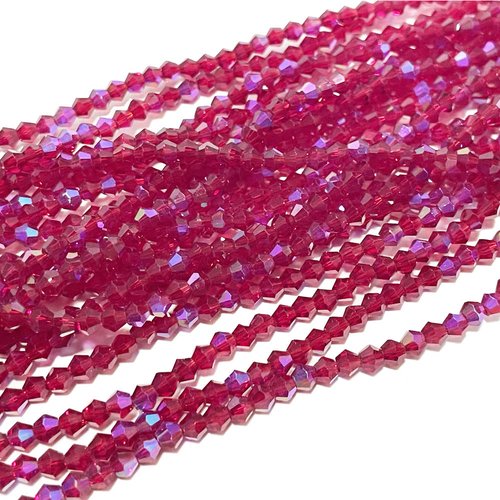 4 mm. perles toupies en verre à facettes. magenta clair ab. env 83 perles