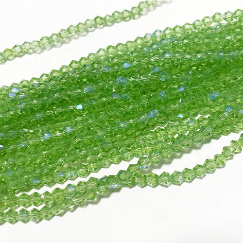 4 mm. perles toupies en verre à facettes. vert clair ab. env 83 perles