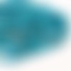 10-12 mm. donut howlite teintée. turquoise. fil env. 35 p.