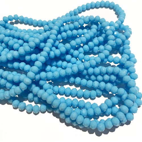 6 *5 mm. perles en verre à facettes. bleu clair. env 88 perles