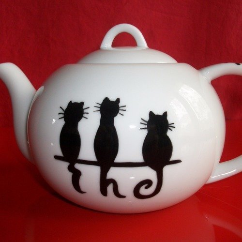 Théière boule en porcelaine de limoges " chats noirs thé "